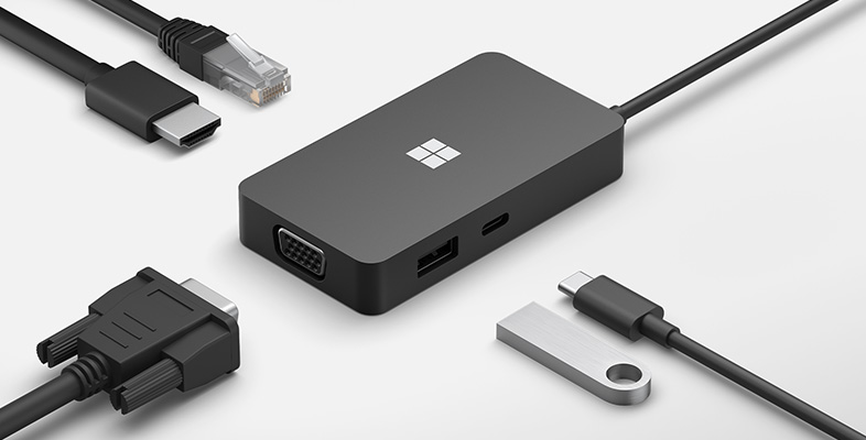 Surface Thunderbolt™ 4 扩展坞的各种端口以及周围各种连接线缆。